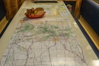 Maps of Colorado in crew's mess with John Fielder pictures in background